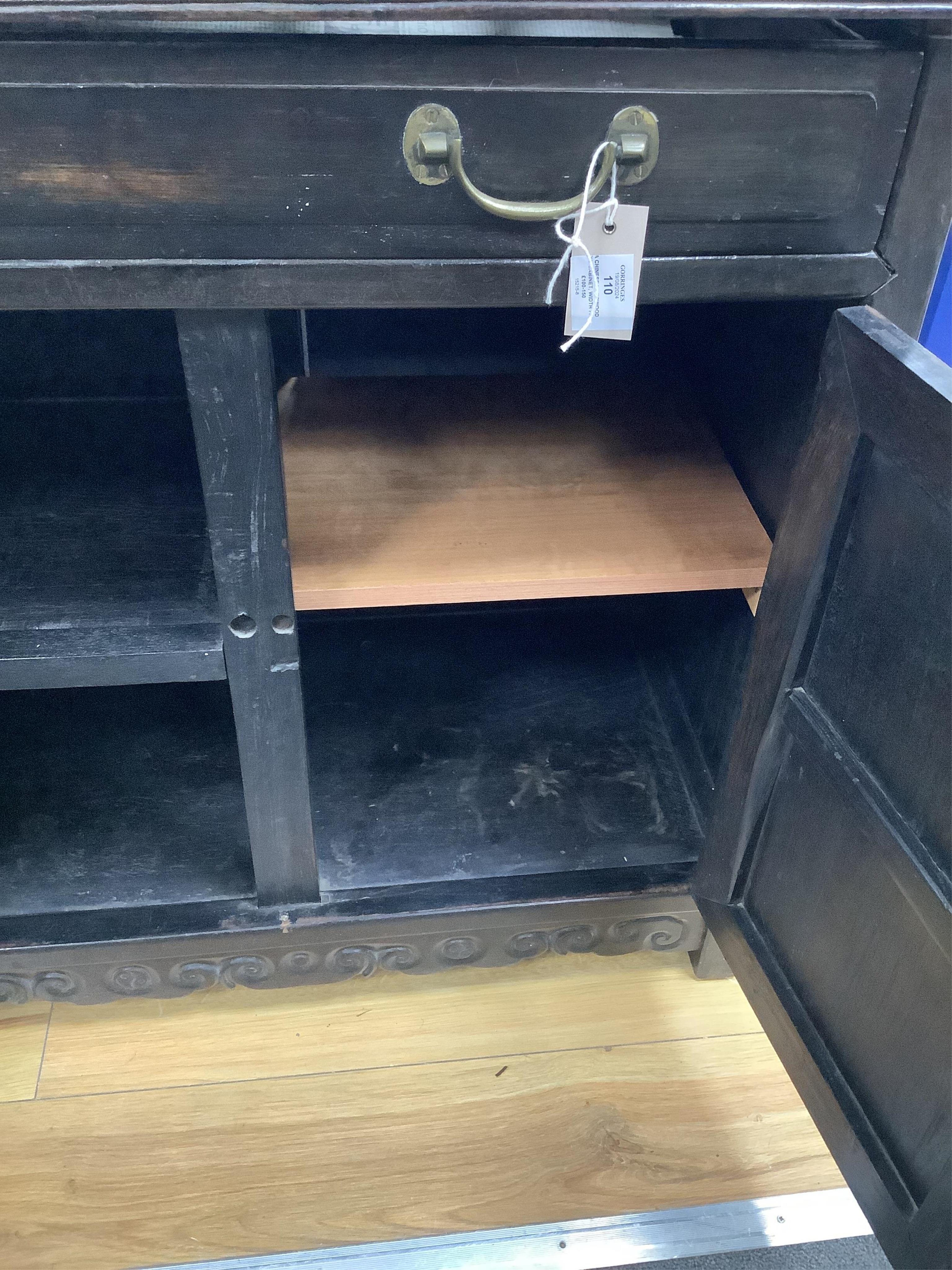 A Chinese hardwood low cabinet, width 77cm, depth 42cm, height 77cm. Condition - fair